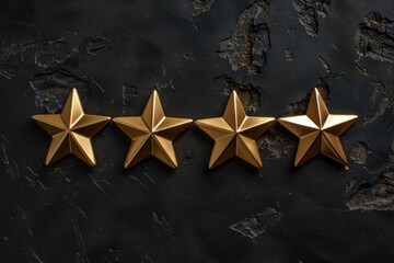 Four gold 3D stars on a black background