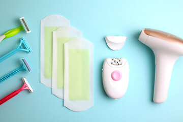 A set of different hair removal products on a wooden table. Removal of unwanted body hair at home. 