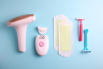 A set of different hair removal products on a wooden table. Removal of unwanted body hair at home. 