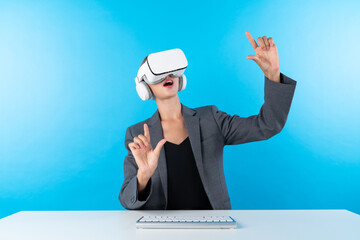 Professional business woman comparing data analysis while using VR goggles. Caucasian manager looking at financial data while connecting with metaverse by using visual reality headset. Contraption.