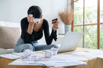 Stressed young woman has financial problems with credit card debt to pay uttermost show concept of bad personal money and mortgage pay management crisis.