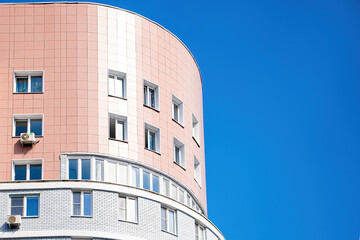 Modern multi-storey building against the blue sky.