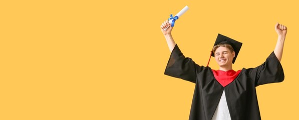 Happy male graduating student holding diploma on yellow background with space for text