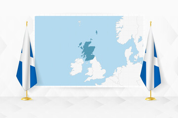 Map of Scotland and flags of Scotland on flag stand.