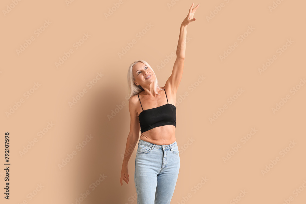 Sticker Body positive mature woman on beige background