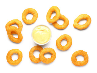 Fried breaded onion rings with mayonnaise on white background