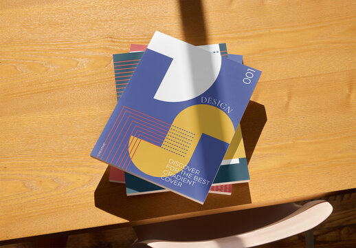 Mockup of vertical magazines stacked up with customizable front covers