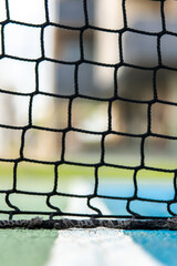 A tennis net with a blue background