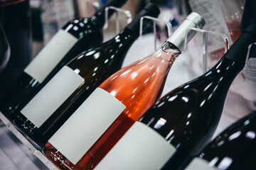 Different bottles of wine presented for wine tasting in a bar or restaurant or wine expo.