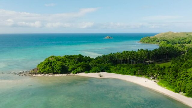 Tropical sandy beach with clear turquoise sea water. Santa Fe, Tablas, Romblon. Philippines.