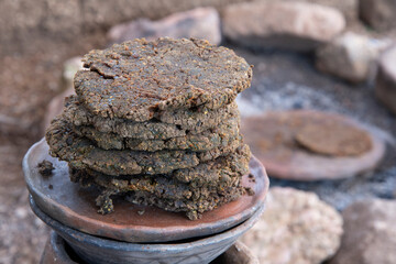Primitive acorn cakes cooked in outdoor fire