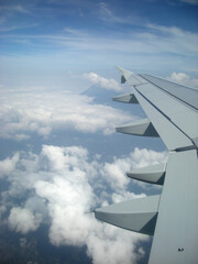 Airplane Wings with Cloud and Sky Background