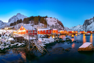 Fantastic evening seascape of Norwegian sea and cityscape of Nusfjord village.