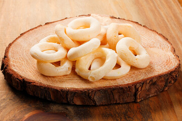 Traditional Brazilian starch biscuit, called polvilho biscuit on rustic wooden table