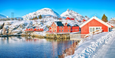 Marvelous snowy morning  cityscape of Sorvagen town and port.