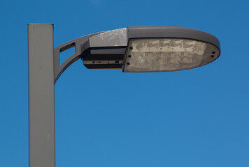 Lamp post against a blue sky