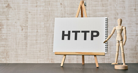 There is notebook with the word HTTP. It is an abbreviation for Hyper Text Transfer Protocol as eye-catching image.