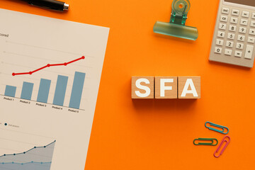 There is wood cube with the word SFA. It is an abbreviation for Sales Force Automation as eye-catching image.
