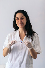 nurse portrait injecting serum into a syringe