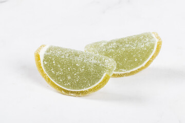 Vegan dessert. Jelly Marmalade "Lime slices". Close-up. White background	