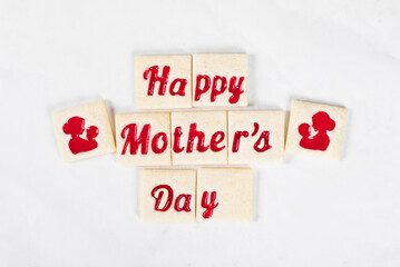 Mothers Day. Cute Delicate square shortbread cookies with marmalade filling in a themed form, happy mother's day, mother and child. White background. Top view
