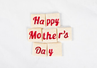 Modern square shortbread cookies with red marmalade filling in a thematic form. White background. Top view. Mother's Day