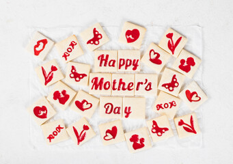 Modern square shortbread cookies with marmalade filling in a thematic form, happy mother's day, mom, flower, butterfly, mother and child, hearts. White background. Top view. Mother's Day