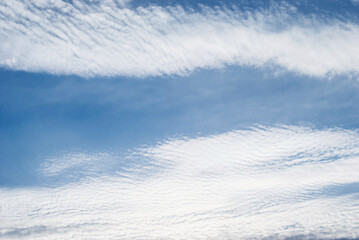 gentle white clouds in the blue sky