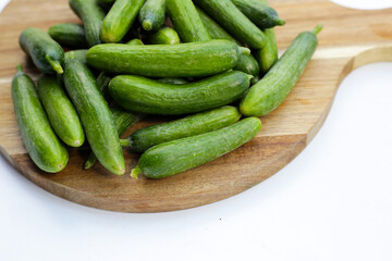 Mini cucumbers on white background.