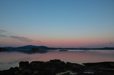 Sunset in the estuary with rafts
