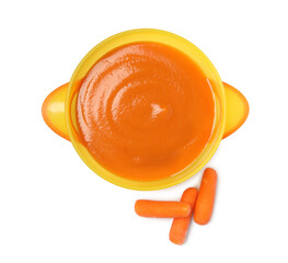 Delicious baby food in bowl and fresh carrots isolated on white, top view