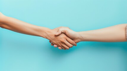 Two people shaking hands against blue background