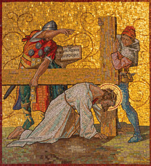 MILAN, ITALY - MARCH 4, 2024: The mosaic Fall of Jesus under the cross as part of Cross way station in church Chiesa di San Agostino by unknown artist of 20. cent.