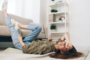 Cosy Living: Woman Relaxing on Modern Sofa in Peaceful Apartment