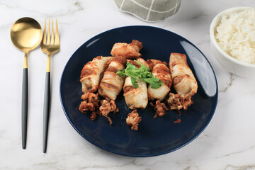 Deep Fried squid with garlic on white table eat with jasmin rice. Asian Thai food. seafood menu.
