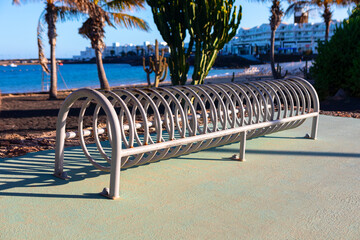 Metal structure for parking bicycles. Bicycle parking area at coastal park