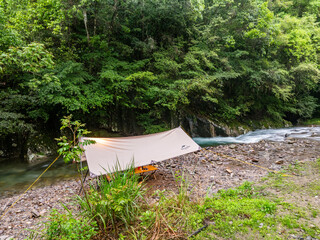 Canopy of camping by the stream