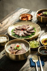 On the table, meat soup, boiled pork, and rice