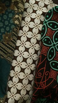 Spinning various motif of batic pattern fabric, Indonesia textured cloth background