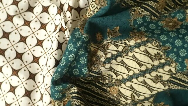 Spinning various motif of batic pattern fabric, Indonesia textured cloth background