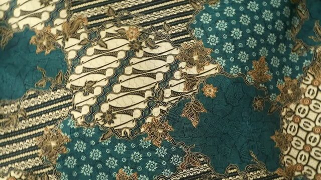 Spinning various motif of batic pattern fabric, Indonesia textured cloth background