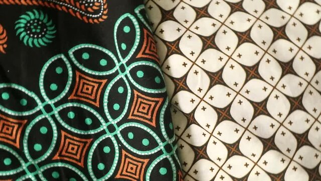 Spinning various motif of batic pattern fabric, Indonesia textured cloth background