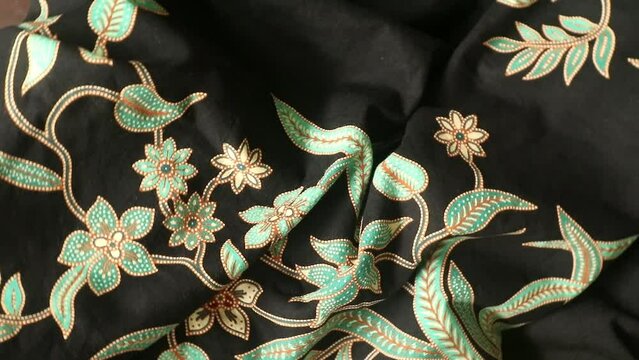 Spinning various motif of batic pattern fabric, Indonesia textured cloth background