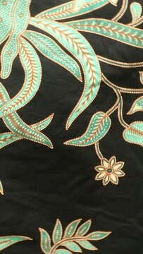 Spinning various motif of batic pattern fabric, Indonesia textured cloth background