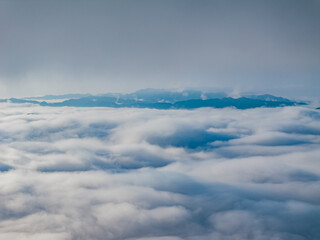 Obraz premium Aerial photography of clouds and fog in the mountains