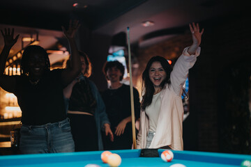 Group of happy friends enjoying a night out playing pool and having fun at a local bar.