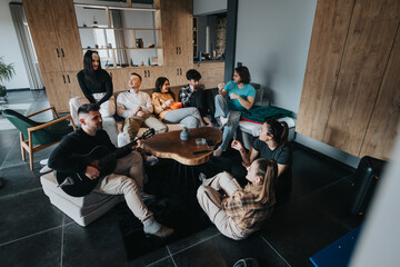 Diverse friends socializing and relaxing together as one plays guitar in a modern living room setting, conveying warmth and togetherness.
