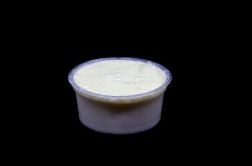 Homemade Curd or Dahi in a Glass Bowl Isolated on Black Background with Copy Space