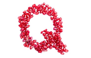 Q English Alphabet Capital Letter Written with Pomegranate Seeds Isolated on White Background