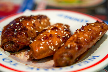 Delicious roasted chicken wings with Swiss sauce in a Hong Kong tea restaurant